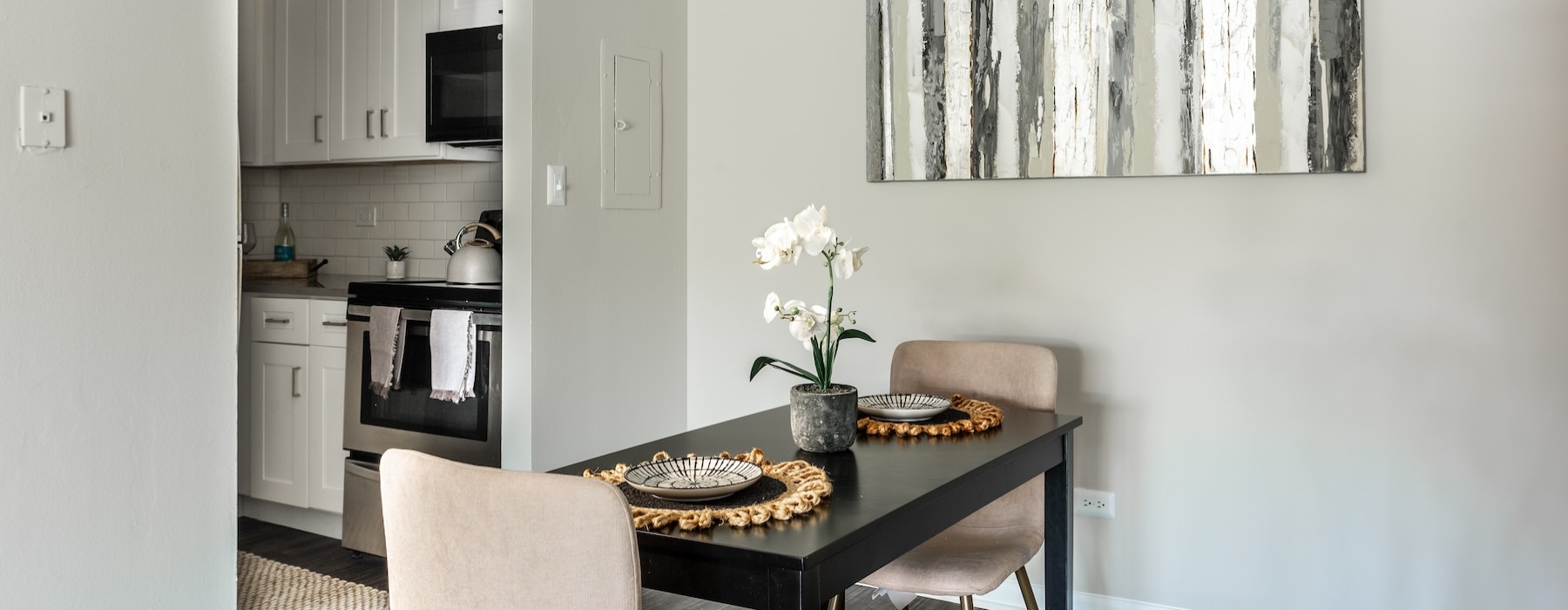 a dining room with a table and chairs
