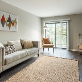 a living room with a couch and chairs