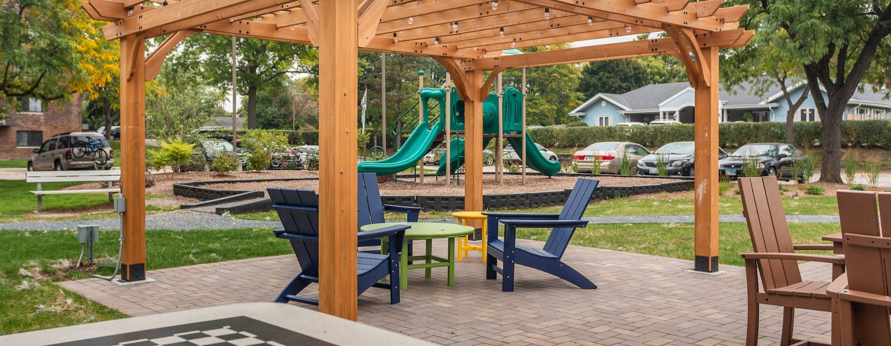 a covered area with a table and chairs